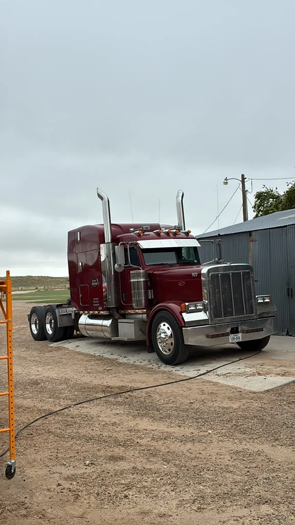 Maroon Peterbilt semi truck at the Panhandle Polishing shop